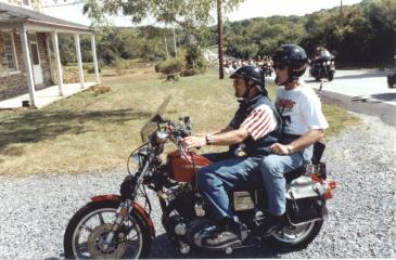 The long line of motorcyclists begins to pull off Hanover Road at the Daniel Lady Farm in Gettysburg.