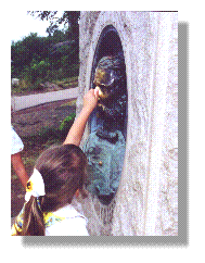 Visitors to the battlefield rub the nose of Patrick O'Rourke.